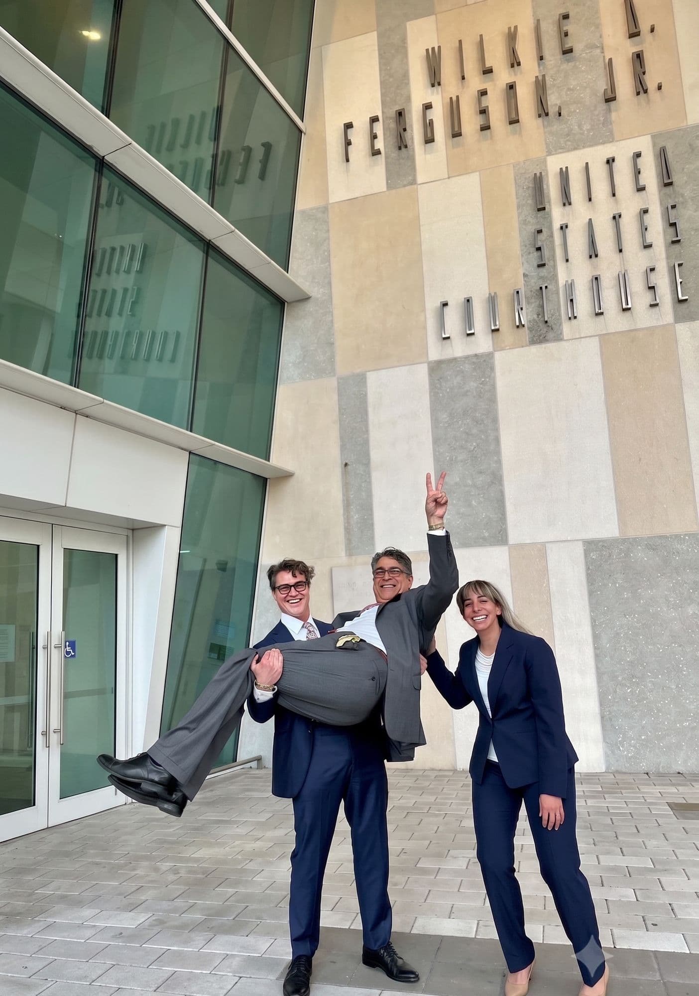 Celebrating a full acquittal outside federal court, Miami